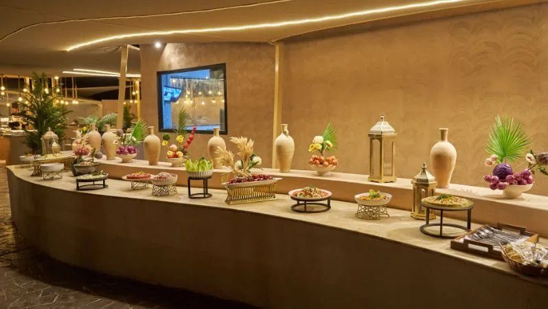international-buffet-at-noble-camp-desert-dinner-dubai.webp